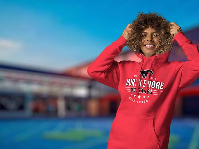 Person wearing a red hoodie with 'North Shore Mustangs' text, standing outdoors. Design 217
