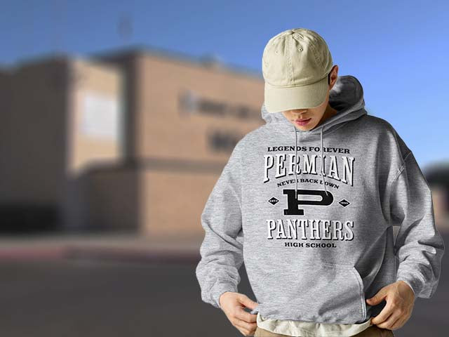 Person wearing a gray hoodie with 'Perman Panthers High School' text, standing outdoors.