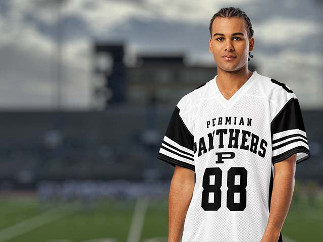 Person wearing a Permian Panthers football jersey with the number 88 on a sports field background.