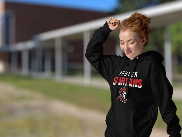 Person wearing a black hoodie with 'Porter Spartans' text and logo outdoors.