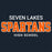 Text graphic reading 'SEVEN LAKES SPARTANS HIGH SCHOOL' on a dark navy background, with 'SPARTANS' in large distressed orange letters outlined in white and the other text in white. Seven Lakes High School Spartans Women's Navy Blue SoftStyle T-shirt 002