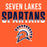 Orange graphic with the words 'SEVEN LAKES SPARTANS' in large white and navy lettering, plus a Spartan helmet logo below. Seven Lakes High School Spartans Orange Classic Unisex T-shirt 024
