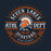 A circular athletic graphic for Seven Lakes Athl Dept Spartans High School, featuring an orange and white Spartan helmet logo centered on a dark navy background with orange rays and white text. Seven Lakes High School Spartans Navy Blue Classic Unisex T-shirt 201