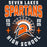 A dark navy graphic design featuring the text 'SEVEN LAKES SPARTANS' in white and orange, with a Spartan helmet logo in the center, 'ESTD 2005' on the sides, and 'HIGH SCHOOL' arched at the bottom. Seven Lakes High School Spartans Women's Navy Blue SoftStyle T-shirt 204
