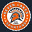 A circular school logo or sticker design reading 'SEVEN LAKES SPARTANS HIGH SCHOOL' with an orange, white, and dark gray Spartan helmet graphic on a dark navy background. Seven Lakes High School Spartans Women's Navy Blue SoftStyle T-shirt 216