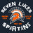 A dark navy graphic design featuring a Spartan helmet with an orange face and white outline, surrounded by a geometric fan motif. The text 'SEVEN LAKES SPARTANS' is written in large distressed white letters, with 'UNLEASH CHAOS' and 'LET'S GO TEAM' in orange on either side, and 'since 2005' below the helmet. Seven Lakes High School Spartans Women's Navy Blue SoftStyle T-shirt 228