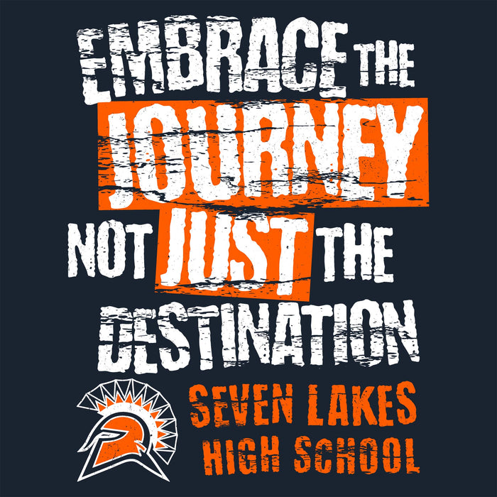 A dark navy graphic design with distressed white and orange text reading 'EMBRACE THE JOURNEY NOT JUST THE DESTINATION' and 'SEVEN LAKES HIGH SCHOOL,' plus a Spartan-style helmet logo. Seven Lakes High School Spartans Women's Navy Blue SoftStyle T-shirt 232