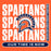 A square orange graphic with repeated distressed white 'SPARTANS' text, a central Spartan helmet logo in navy and orange, a vertical black banner reading 'SEVEN LAKES HIGH SCHOOL' on the right, and a navy rounded bar at the bottom reading 'OUR TIME IS NOW'. Seven Lakes High School Spartans Orange Classic Unisex T-shirt 235