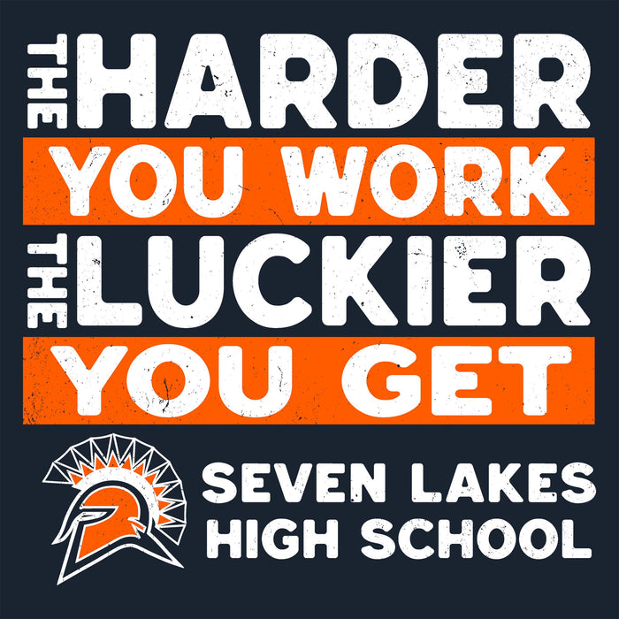 A square graphic with the motivational phrase 'THE HARDER YOU WORK THE LUCKIER YOU GET' in distressed white text on orange and dark navy blocks, plus a Seven Lakes High School logo and text at the bottom. Seven Lakes High School Spartans Women's Navy Blue SoftStyle T-shirt 238