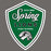 A shield-shaped Spring Lions High School emblem with a green background, white border, white script and block lettering, and a white lion head illustration on a dark gray backdrop. Spring High School Lions Dark Grey Classic Unisex T-shirt 225