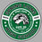A circular green, white, and black graphic design featuring a lion head illustration in the center, with the text 'SPRING LIONS HIGH SCHOOL' and additional phrases like 'SPIRIT MODE ACTIVATED' and 'GAME DAY READY - ALL DAY ANYTIME' on a gray background. Spring High School Lions Women's Grey SoftStyle T-shirt 239