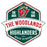 A vintage-style school logo or sticker design for The Woodlands Highlanders High School, featuring a dark green shield with red and white borders, a large red and white 'W', and the words 'THE WOODLANDS HIGHLANDERS HIGH SCHOOL' on a white banner, with a mascot illustration at the top. The Woodlands High School Highlanders Unisex 3/4 sleeve Raglan T-shirt 209