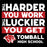 A square graphic design with the motivational phrase 'THE HARDER YOU WORK THE LUCKIER YOU GET, TOMBALL HIGH SCHOOL' in distressed white text on red and black blocks, plus a red tomahawk mascot logo. Tomball High School Cougars Classic Unisex Black T-shirt 238