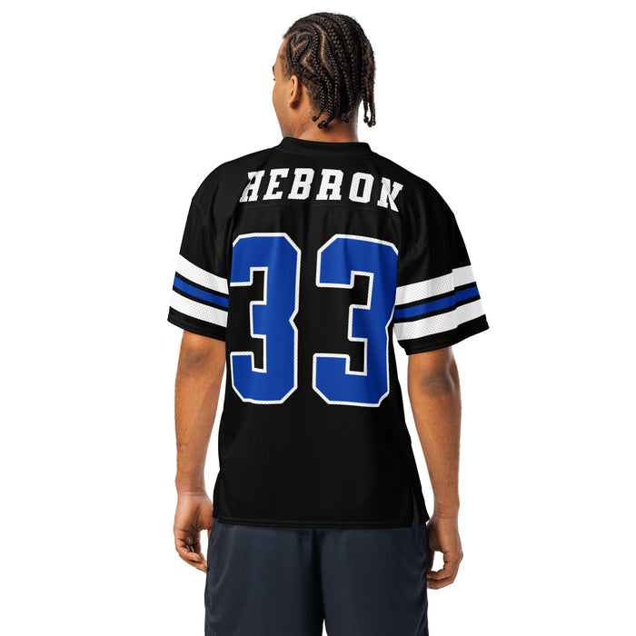 Back view of man wearing Hebron High School Hawks Football Jersey 33