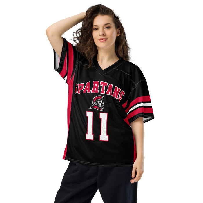 Woman wearing a black Spartans sports jersey with red and white accents on a white background
