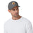 Man wearing Jersey Village High School Falcons Dark Grey Flexfit Baseball Cap 210