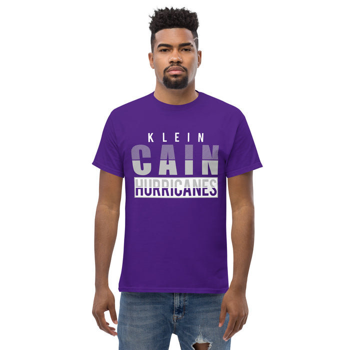 A man wearing a Klein Cain High School Hurricanes Purple Classic T-shirt 31