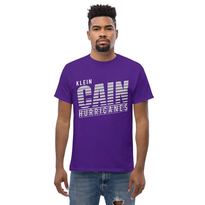 A man wearing a Klein Cain High School Hurricanes Purple Classic T-shirt 32