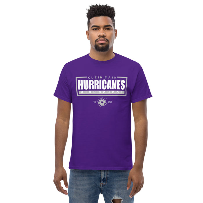 A man wearing a Klein Cain High School Hurricanes Purple Classic T-shirt 49