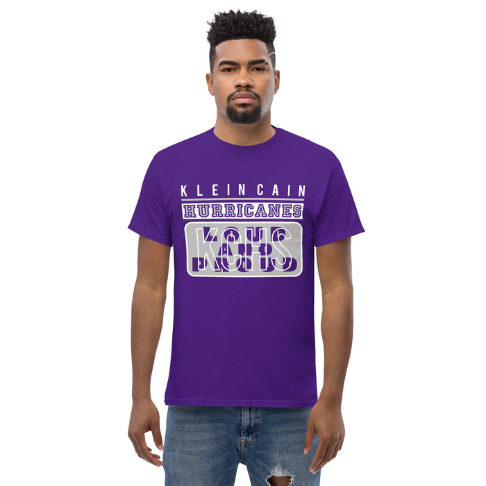 A man wearing a Klein Cain High School Hurricanes Purple Classic T-shirt 86