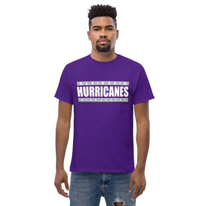 A man wearing a Klein Cain High School Hurricanes Purple Classic T-shirt 98