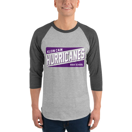 Man wearing a Klein Cain High School Hurricanes Unisex 3/4 Sleeve Raglan T-shirt 84