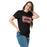 Woman wearing Del Valle High School Cardinals Black Classic Unisex T-shirt 098