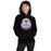 Woman wearing a Morton Ranch High School Mavericks Black Classic Unisex Hoodie 210