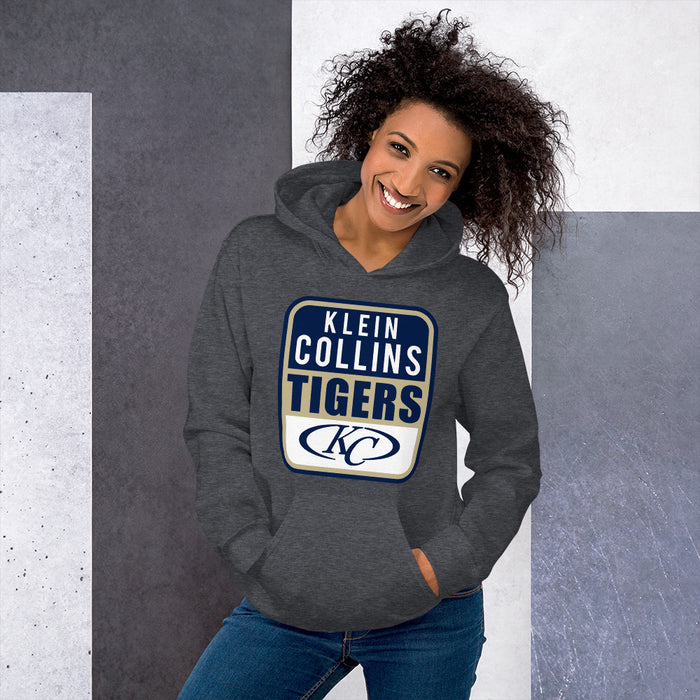 Woman wearing a Klein Collins High School Tigers Dark Heather Classic Unisex Hoodie 01