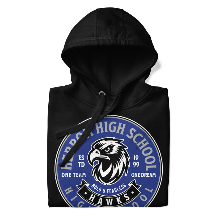 A close-up picture of a black hoodie with the Hebron High School Hawks logo folded neatly. This hoodie features design #215