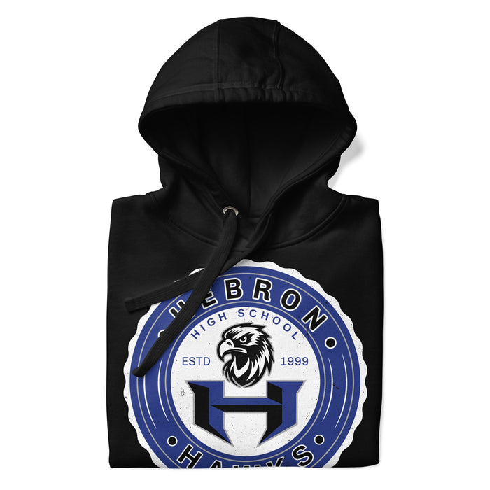 A close-up picture of a black hoodie with the Hebron High School Hawks logo folded neatly. This hoodie features design #217