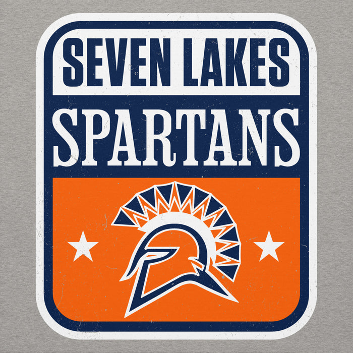 A rectangular graphic decal or sticker with rounded corners featuring the text 'SEVEN LAKES SPARTANS' in navy and white, above an orange panel with a Spartan helmet logo and two white stars, shown on a light gray background. Seven Lakes High School Spartans Grey Premium Unisex Hoodie 001