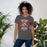 Woman wearing North Shore High School Mustangs Dark Grey Premium Unisex T-shirt 207