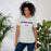 A woman wearing Klein Cain High School Hurricanes Premium Athletic Heather T-shirt 12