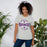 Woman wearing a Morton Ranch High School Mavericks Premium Athletic Heather Unisex T-shirt 211