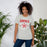 Woman wearing MacArthur High School Generals Grey Premium Unisex T-shirt 204