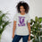 Woman wearing Morton Ranch High School Mavericks Premium Grey Unisex T-shirt 205