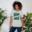 Woman wearing Reagan High School Rattlers Grey Premium Unisex T-shirt 241