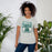 Woman wearing Reagan High School Rattlers Grey Premium Unisex T-shirt 001