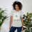 Woman wearing Spring High School Lions Grey Premium Unisex T-shirt 236