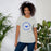 Woman wearing Taylor High School Mustangs Grey Premium Unisex T-shirt 214