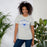 Woman wearing Taylor High School Mustangs Grey Premium Unisex T-shirt 211