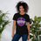 Woman wearing a Morton Ranch High School Mavericks Premium Black Unisex T-shirt 216