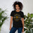 Woman wearing a Klein Oak High School Panthers Premium Black Unisex T-shirt 220