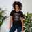 Woman wearing Langham Creek High School Lobos Black Premium Unisex T-shirt 207