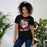 Woman wearing MacArthur High School Generals Black Premium Unisex T-shirt 205