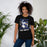 Woman wearing New Caney High School Eagles Black Premium Unisex T-shirt 205