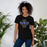 Woman wearing Hebron High School Hawks Black Premium Unisex T-shirt 040