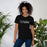 Woman wearing Hebron High School Hawks Black Premium Unisex T-shirt 200