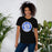 Woman wearing New Caney High School Eagles Black Premium Unisex T-shirt 220